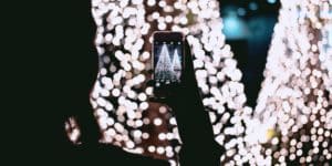 Person taking picture of Christmas trees